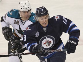 Bryan Little (right) and his fellow linemates, Evander Kane and Blake Wheeler, have had trouble staying together due to injuries. (BRIAN DONOGH/Winnipeg Sun files)