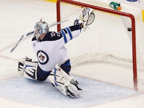 Jets goalie Chris Mason gave up a goal to Jeff Skinner early and a soft one to Tim Brent as the Jets fell 2-1 to the Hurricanes. (ELLEN OZIER/Reuters)