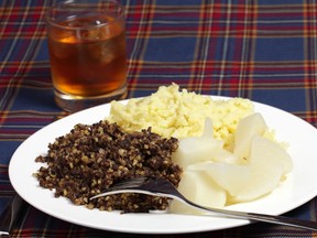 Traditional Scottish haggis, served with tatties (mashed potatoes), turnip and scotch whisky. (Shutterstock)