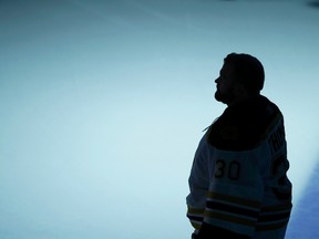 Boston Bruins goalie Tim Thomas stands during the singing of the national anthems before the Bruins play the Vancouver Canucks in Game 1 of the NHL Stanley Cup hockey finals in Vancouver, British Columbia, June 1, 2011.  REUTERS/Mike Blake