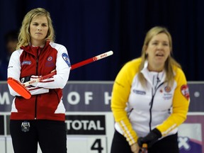 Cathy Overton-Clapham (right) competes against Jennifer Jones at the national Scotties champion-ship in Charlottetown last February. The rivals will likely face each other in Portage.