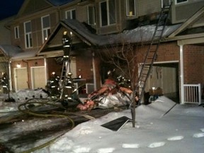 Ottawa firefighters battle a fire in a rowhouse unit at 146 Parkrose Private in Orleans. (Ottawa Fire Service photo)