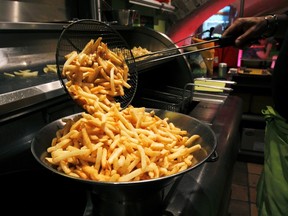 A cook prepares fries in Bruges, September 27, 2011. REUTERS/Thierry Roge, file