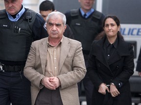 In his closing argument, Defence counsel Patrick McCann said his principle client Hamed Shafia, his mother Tooba Yahya (rear) and father Mohammad (front, centre) are innocent of murder.