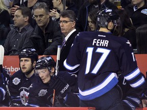 Winnipeg Jets coach Claude Noel, watching as his team prepares for a faceoff during an NHL game in December, has been able to instill in his team a culture of hard work and caring. (JASON HALSTEAD/WINNIPEG SUN)