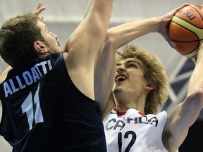 Ottawa’s Tyson Hinz (right) takes a shot against Alejandro Alloatti of Argentina during a men’s preliminary round basketball game at the Pan American Games in Guadalajara in October. Hinz, who led Carleton to a CIS championship in 2011, was named male athlete of the year at the Ottawa Sports Awards. (File photo)