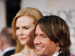 Actress Nicole Kidman (L) and her husband, musician Keith Urban, arrive at the 69th annual Golden Globe Awards in Beverly Hills, California January 15, 2012. (REUTERS/Danny Moloshok)