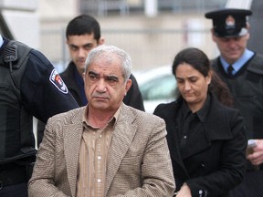 Mohammad Shafia, his wife Tooba Mohammad Yahya and their son Hamed arrive at the Frontenac County Courthouse in Kingston on January 25, 2012. (IAN MACALPINE/QMI Agency)