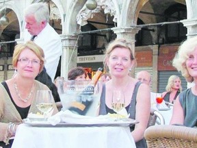 Food writer Jill Wilcox, left, enjoys lunch in Italy with Taste of France tour operators Carol Panczyk, middle, and Nancy Evans, two of four partners who own Maison Beaufort which serves as the base for tours of southern France. They are now planning a tour in Italy.