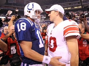 Giants quarterback Eli Manning congratulates Colts quarterback Peyton Manning after a Colts victory against the Giants at Lucas Oil Stadium in Indianapolis, Ind., Sep. 19, 2010. (ANDY LYONS/Getty Images/AFP)