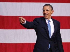 U.S. President Barack Obama arrives to deliver remarks on energy security at Buckley Air Force Base and Air National Guard Hangar in Aurora, Colorado, January 26, 2012.    REUTERS/Jason Reed