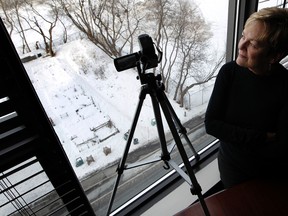 Janine Hutt has set up a video surveillance camera in her condo, pointed at the Laurier Ave. bike path to record the number of cyclist that use the bath. (Tony Caldwell/Ottawa Sun)