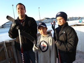 Fort Garry hockey coach Curtis Rossow was suspended three games because the team's entire coaching staff forgot about a game which the team was forced to forfeit. With Rossow were his son, Jordan, 10, (left) and Cole Radcliffe, 10, who both play on the team coached by Rossow.
JASON HALSTEAD/WINNIPEG SUN QMI AGENCY
