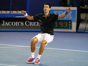 Novak Djokovic of Serbia celebrates after defeating Rafael Nadal of Spain in their men's singles final match at the Australian Open tennis tournament in Melbourne January 29, 2012. REUTERS/Mark Blinch
