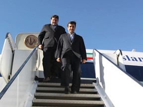 Iranian President Mahmoud Ahmadinejad walks down the steps of a plane as he arrives in Kerman province, southeast of Iran January 26, 2012. The European Union rather than Iran will lose out under new EU sanctions banning Iranian oil, Ahmadinejad said on Thursday as lawmakers said they might cut supplies to EU countries ahead of a July 1 deadline. REUTERS/President.ir/Handout