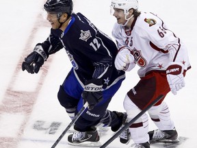 Jarome Iginla and Erik Karlsson laugh after accidentally colliding in the 2012 Tim Hortons NHL All-Star Game at Scotibank Place in Ottawa. Sunday, Jan. 29,2012. (ERROL MCGIHON/OTTAWA SUN)