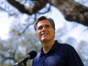 Republican presidential candidate and former Massachusetts Governor Mitt Romney answers questions from reporters outside his campaign offices in Tampa, Florida January 31, 2012.  REUTERS/Brian Snyder