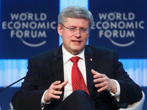 Canada's Prime Minister Stephen Harper addresses a session at the World Economic Forum (WEF) in Davos, January 26, 2012.      REUTERS/Christian Hartmann
