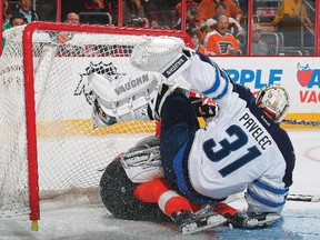 One of the only times Ondrej Pavelec didn’t make the stop was when Tom Sestito crashed into the Winnipeg Jets net. (PAUL BERESWILL/AFP-Getty Images)
