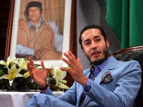 Al Saadi Gadhafi, the third son of Libyan leader Moammar Gadhafi, speaks at a news conference in Sydney in this February 7, 2005 file photo. (REUTERS/Tim Wimborne/Files)