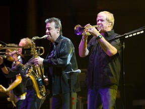 Lee Loughnane (trumpet) and Walt Parazaider (saxaphone) founding members of Chicago on stage tonight,  January 31, 2012, as veteran rock-jazz group Chicago played Massey Hall.  
(Stan Behal Photo/QMI Agency)