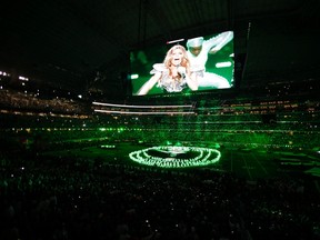 Fergie from the Black Eyed Peas is seen on a screen during the halftime show at the NFL's Super Bowl XLV in Arlington, Texas, February 6, 2011. (REUTERS/Gary Hershorn)