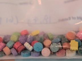 A sample of the drug known as ecstasy is shown at a Calgary police press conference, January 11, 2012. (QMI Agency)