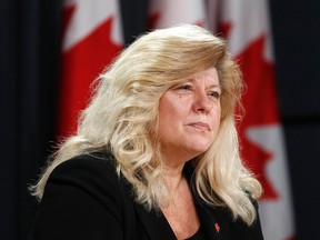 Canada's Federal Ombudsman for Victims of Crime Sue O'Sullivan listens to a question during a news conference on the release of her report in Ottawa February 2, 2012.    (REUTERS/Chris Wattie)