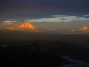 The Cotopaxi mountain, the highest active volcano in Ecuador, is seen from a plane during a flight to Quito April 24, 2011. REUTERS/Guillermo Granja