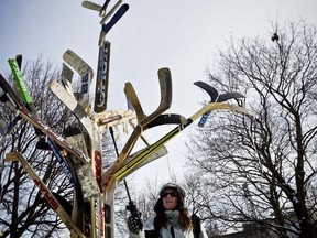 Artist Liz Pead sprays down her installation at Confederation Park entitled "Ice Hockey Trees" in advance of Winterlude which officially opens on February 3,2012. Thursday February 2,2012. 
(ERROL MCGIHON/OTTAWA SUN)