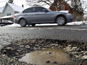 A large pothole on Churchill Avenue in Ottawa.(ERROL MCGIHON/OTTAWA SUN)