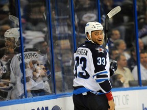 Dustin Byfuglien had more than 25 minutes of ice time and chipped in an assist on the winning goal in his return to the lineup against the Tampa Bay Lightning on Feb. 2, 2012. (BRIAN BLANCO/REUTERS)