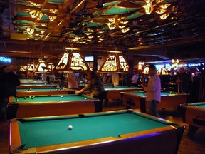 Billiard tables at Billy Bob's Texas attract crowds of players taking breaks from line dancing or watching a live rodeo at the bar. The former cattle barn is the world's biggest honky tonk – 127,000 sq-ft of fun. (WAYNE NEWTON/QMI Agency)