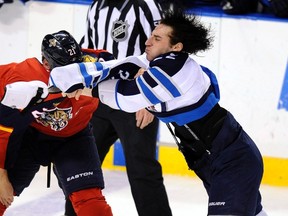 Chris Thorburn takes Krys Barch in a spirited fight Friday night. (Reuters/Rhona Wise)