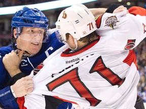 Toronto Maple Leafs Dion Phaneuf (L) and Ottawa Senators Nick Foligno fight during the second period of their NHL hockey game in Toronto January 17, 2012. (REUTERS/Fred Thornhill)