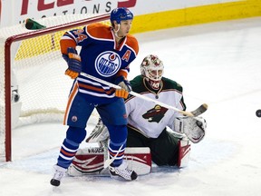 Edmonton's Ryan Smyth and Minnesota's Niklas Backstrom keep a sharp eye on the puck during the Edmonton Oilers NHL hockey game against the Minnesota Wild at Rexall Place in Edmonton on Thursday, December 22, 2011. CODIE MCLACHLAN/EDMONTON SUN QMI AGENCY