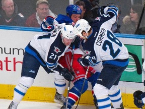 Aaron Gagnon and fellow call-up Patrice Cormier fight for the puck with New York Rangers centre Derek Stepan in New York on Jan. 24, 2012. (RAY STUBBLEBINE/REUTERS Files)