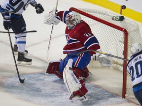 Winnipeg’s Antti Miettinen tries to score on Montreal goalie Carey Price during their NHL game at the Bell Centre on Sunday.  Though Price got two good saves on Miettinen, when he had an open net, he should have scored. (PIERRE-PAUL POULIN/QMI Agency)
