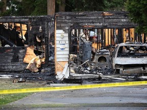 Police tape cordons off the front of a house which was destroyed by a gas explosion in Graham, Washington, February 5, 2012. The house explosion on Sunday killed the father and two boys involved in a bitter custody dispute, two years after the family's mother disappeared. REUTERS/Cliff Despeaux