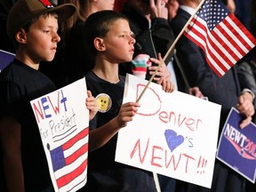 Boys hold a signs they made in support of Republican presidential candidate Newt Gingrich at a Gingrich campaign event in Golden, Colorado February 6, 2012. The Colorado caucuses take place February 7, 2012. REUTERS/Rick Wilking
