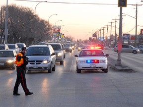 Winnipeg policed helped direct traffic after traffic lights went out at the corner of McPhillips Street and Jefferson Avenue the afternoon of Tuesday, Feb. 7, 2012. (Courtesy Stan Milosevic)