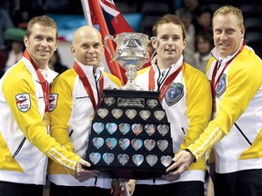Jon Mead, Reid Carruthers and Steve Gould hold the Tankard Trophy at the Brier in London, Ont. The foursome is  gunning for more hardware at the Safeway Championship this week in Dauphin. (MARK BINCH/Reuters files)