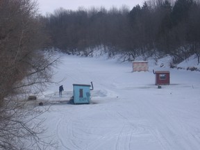 Ice fishing huts cluster on the Castor River, a South Nation River tributary that flows through Embrun. (Tom Van Dusen/Ottawa Sun)