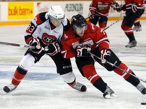 Ottawa 67's defenceman Cody Ceci battles Owen Sound's Daniel Catenacci in a game at the Civic Centre in November. (Darren Brown/Ottawa Sun)