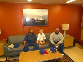 Mitchell James, brother Bradley James and Bradley's son West, 9, of Edmonton -- were rescued by the U.S. Coast Guard when their 38-foot sailboat was disabled in rough waters about 450 km northeast of Hilo, Hawaii. (photo courtesy of Horizon Lines Inc.)
