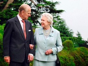 Britain's Queen Elizabeth and Prince Philip walk at Broadlands in Romsey, southern England, in this undated photograph taken in 2007. (REUTERS/Fiona Hanson/Pool)