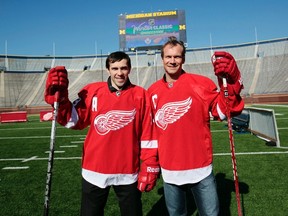 Pavel Datsyuk (left) and Nicklas Lidstrom stand on the field at Michigan Stadium in Ann Arbor, Mich., on Thursday, Feb. 9, 2012. (REUTERS/Rebecca Cook)