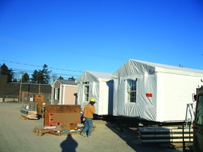 Modular homes with high insulation factors are packaged and ready to be transported from Penetanguishene to Attawapiskat, Ont. (File photo)