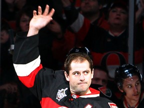Chris Phillips acknowledges Senators fans Saturday at Scotiabank Place after he was honoured for playing in 1,000th NHL game. (Darren Brown, Ottawa Sun)