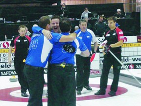 Brandon's Rob Fowler (centre) celebrates being crowned Manitoba champion on Sunday. (JIM BENDER/Winnipeg Sun)